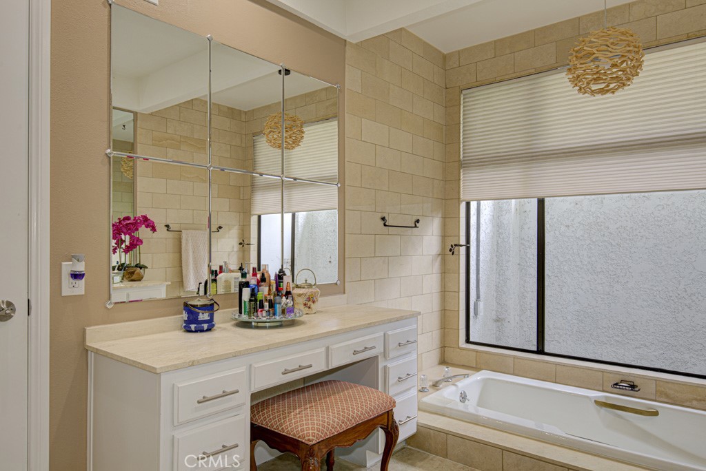 Primary bathroom features a vanity area. - 5553 Rayo Del Sol B, Laguna Woods CA 92637 - photo 30