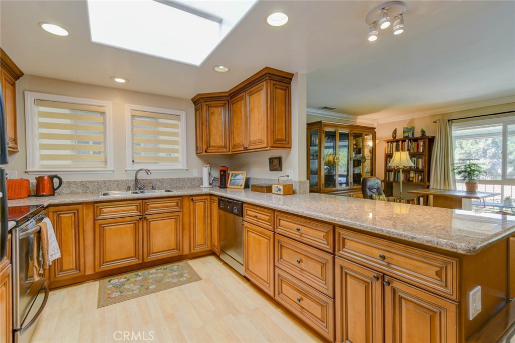 REMODELED KITCHEN WITH SKYLIGHT - 633 Avenida Sevilla O, Laguna Woods CA 92637 - photo 2