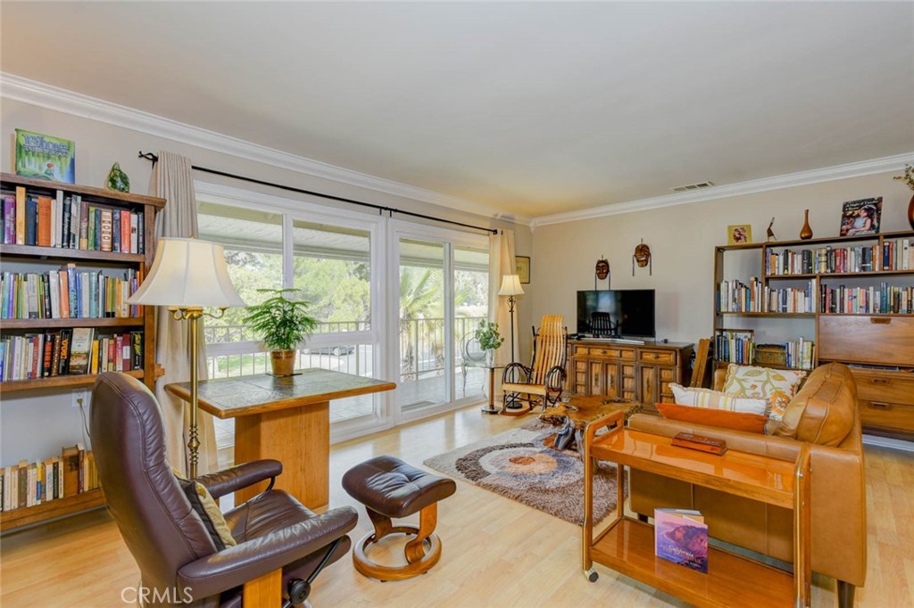 LIVING ROOM W SLIDING DOOR TO THE BALCONY - 633 Avenida Sevilla O, Laguna Woods CA 92637 - photo 4