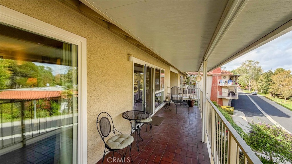 DOORS FROM LIVING ROOM & GUEST BEDROOM TO BALCONY - 633 Avenida Sevilla O, Laguna Woods CA 92637 - photo 26