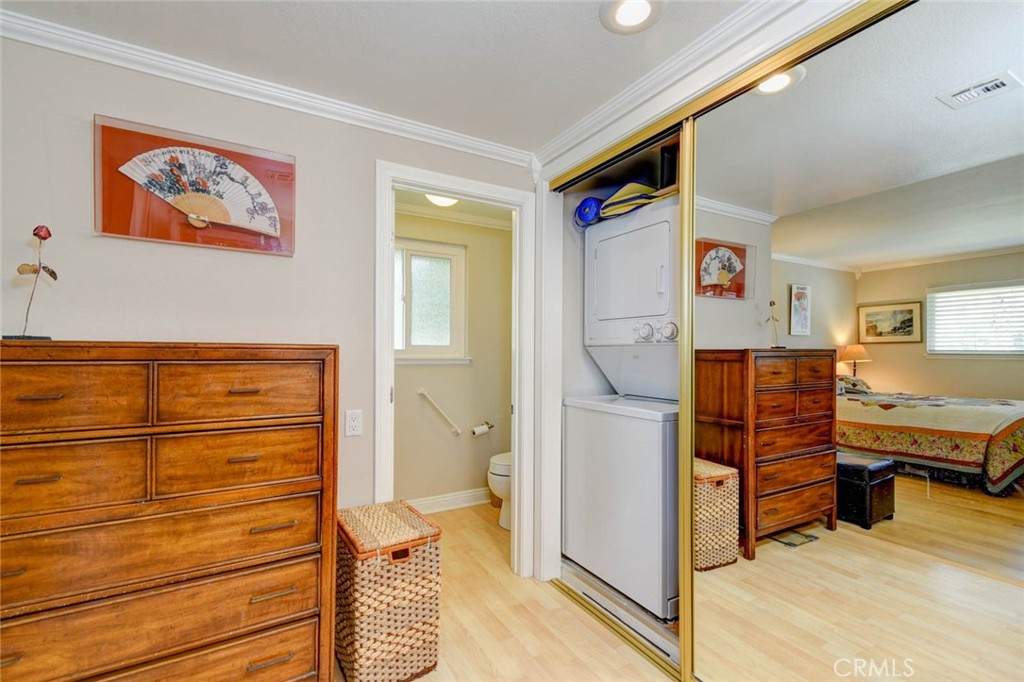 STACKABLE WASHER/DRYER IN THE CLOSET OF PRIMARY BATHROOM - 633 Avenida Sevilla O, Laguna Woods CA 92637 - photo 28