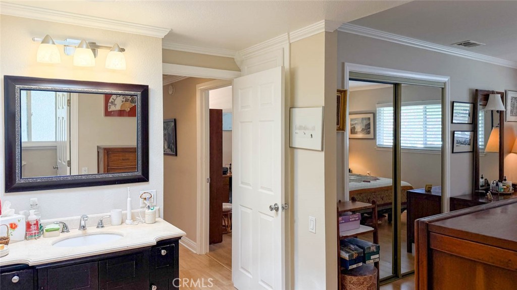 VIEW OF HALLWAY FROM PRIMARY BEDROOM - 633 Avenida Sevilla O, Laguna Woods CA 92637 - photo 30