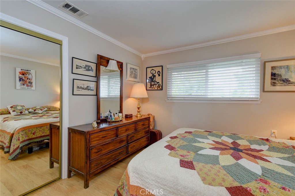 PRIMARY BEDROOM MIRRORED DOOR CLOSET - 633 Avenida Sevilla O, Laguna Woods CA 92637 - photo 32