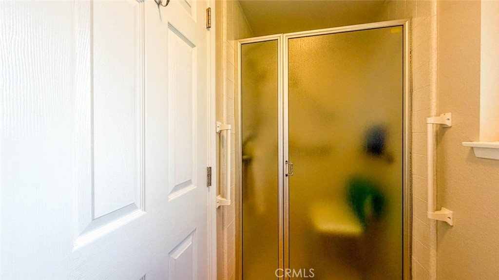 SHOWER ENCLOSURE IN THE PRIMARY BATHROOM - 633 Avenida Sevilla O, Laguna Woods CA 92637 - photo 37