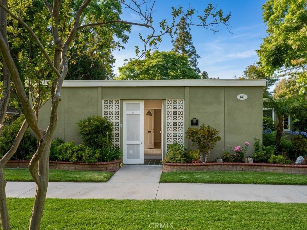 Very few homes can boast about having this welcoming location. Facing an amazing park like setting, surrounded by mature - 68 Calle Aragon C, Laguna Woods CA 92637 - photo 1