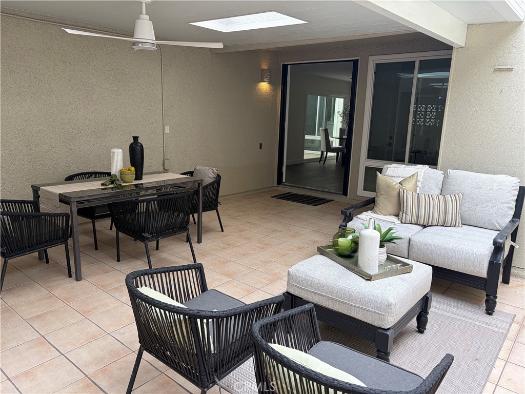 Spacious entertaining patio with cooling ceiling fan - 747 AVENIDA MAJORCA C, Laguna Woods CA 92637 - photo 1