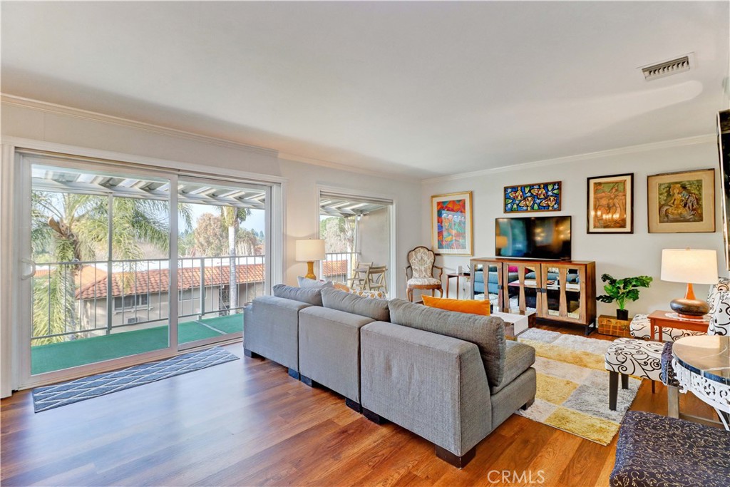 LIVING ROOM & BALCONY WITH PRETTY VIEW - 881 Via Mendoza O, Laguna Woods CA 92637 - photo 2