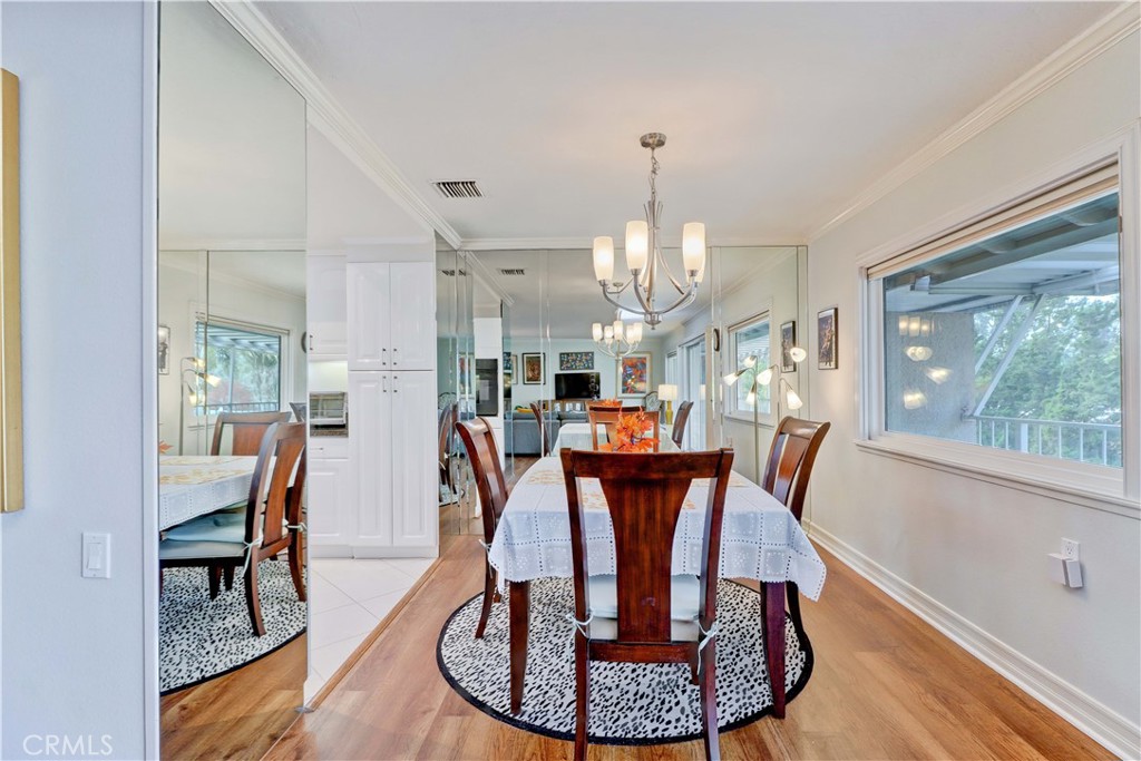 DINING AREA-KITCHEN TO LEFT, BALCONY WINDOW RIGHT - 881 Via Mendoza O, Laguna Woods CA 92637 - photo 12