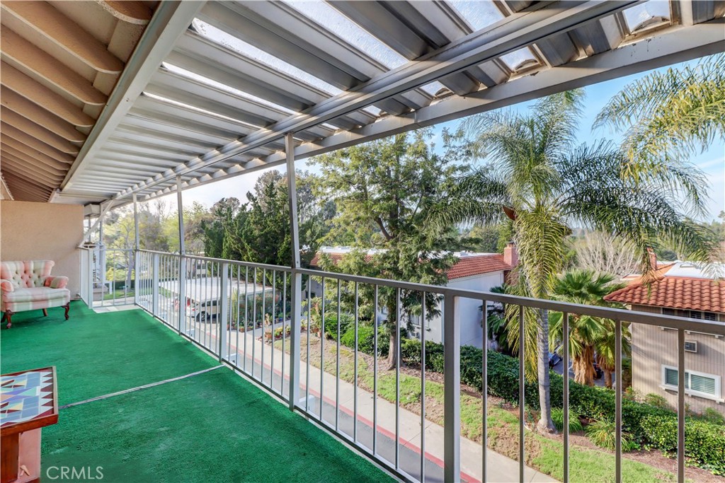 LARGE BALCONY WITH TREE TOP AND HILLS VIEW - 881 Via Mendoza O, Laguna Woods CA 92637 - photo 18