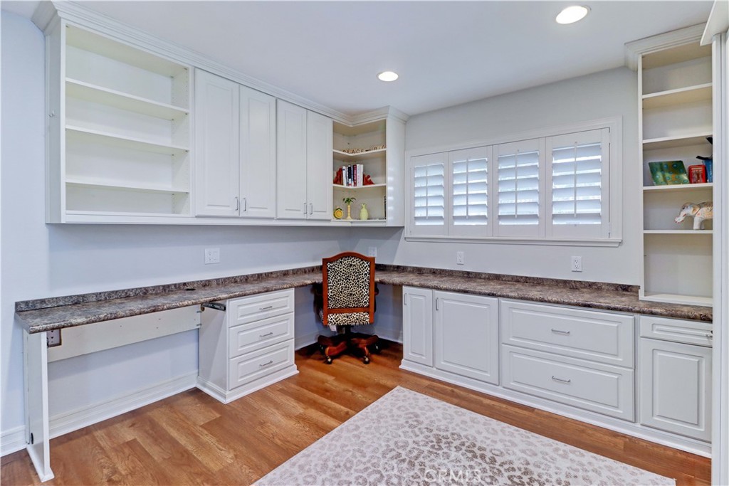 SECOND BEDROOM WITH PLANTATION SHUTTERS & CABINETS - 881 Via Mendoza O, Laguna Woods CA 92637 - photo 22