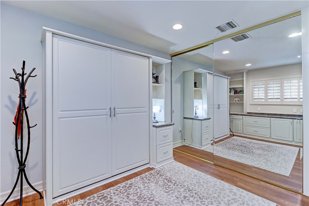 SECOND BEDROOM MIRRORED CLOSET DOORS - 881 Via Mendoza O, Laguna Woods CA 92637 - photo 23