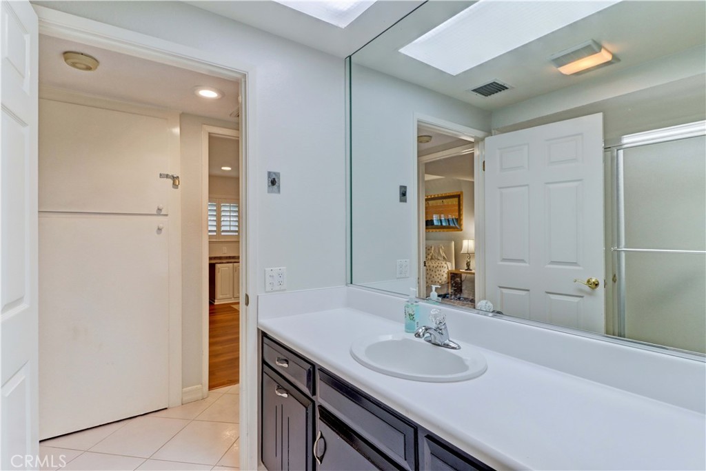 HALL BATHROOM WITH TILE FLOORING & SKYLIGHT - 881 Via Mendoza O, Laguna Woods CA 92637 - photo 25