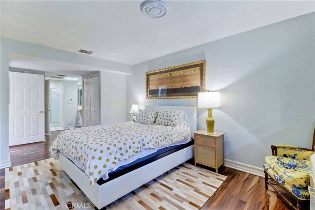 PRIMARY BEDROOM LAMINATE FLOORING - 881 Via Mendoza O, Laguna Woods CA 92637 - photo 30