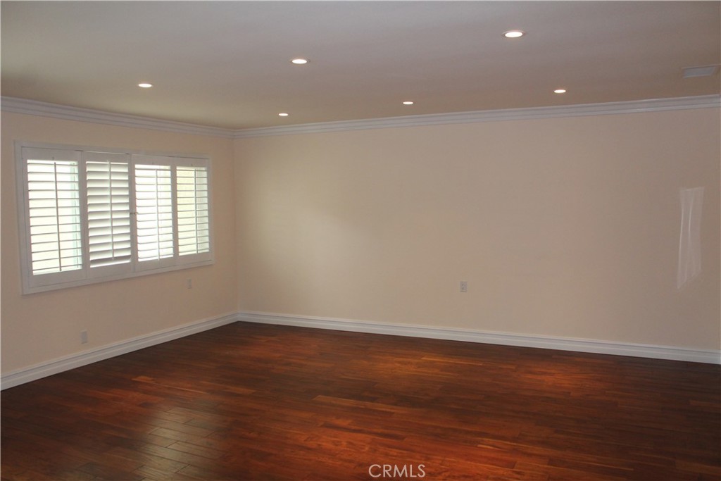 Large open living room with Plantation Shutters - 963 Calle Aragon C, Laguna Woods CA 92637 - photo 6