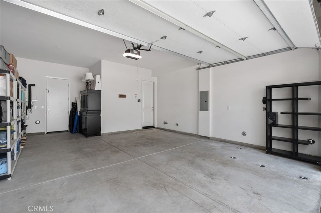 An oversized two-car garage provides additional storage space and convenient side-door access to the yard. - 111 Edna Parkway, Lake Forest CA 92630 - photo 35