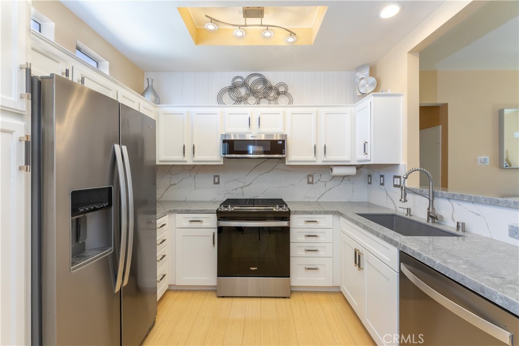 Newly remodeled kitchen with stainless steel appliances. - 112 Santa Barbara Court, Lake Forest CA 92610 - photo 1
