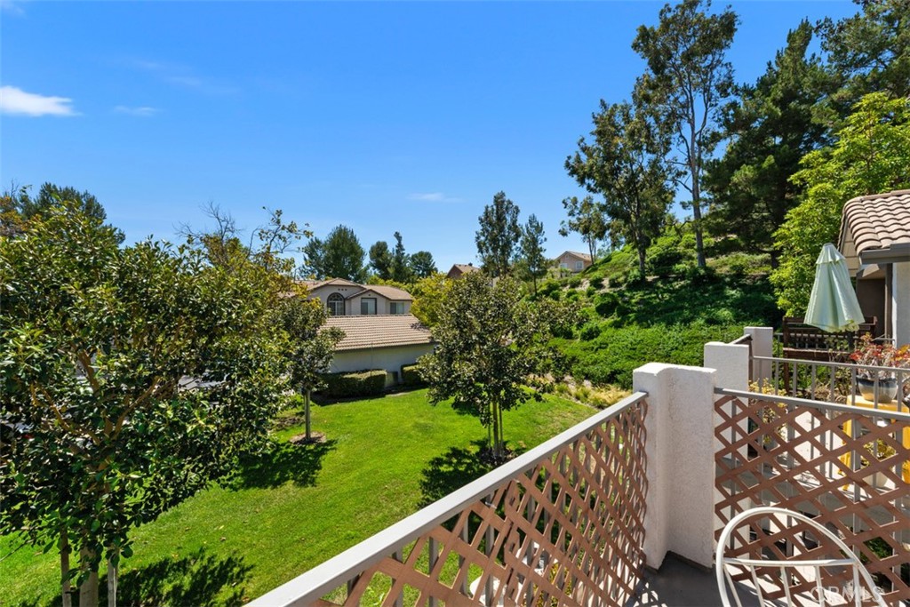 Tranquil greenbelt view from a generous private balcony. - 151 Chaumont, Lake Forest CA 92610 - photo 1