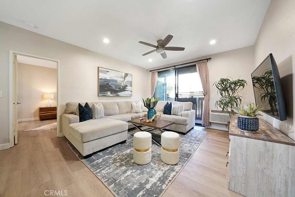 Spacious living area, with ceiling fan, opens to patio - 20702 El Toro Road 397, Lake Forest CA 92630 - photo 1