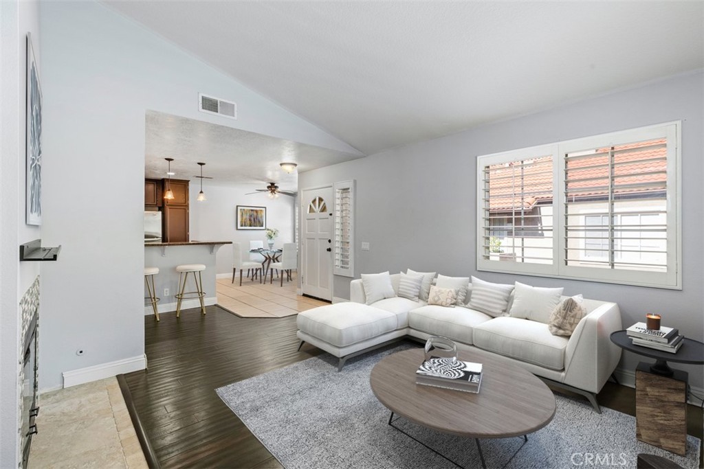 Beautiful remodeled end unit. This home has been recently freshly painted throughout. *Photo is virtually staged. - 21227 Camelia 18, Lake Forest CA 92630 - photo 1