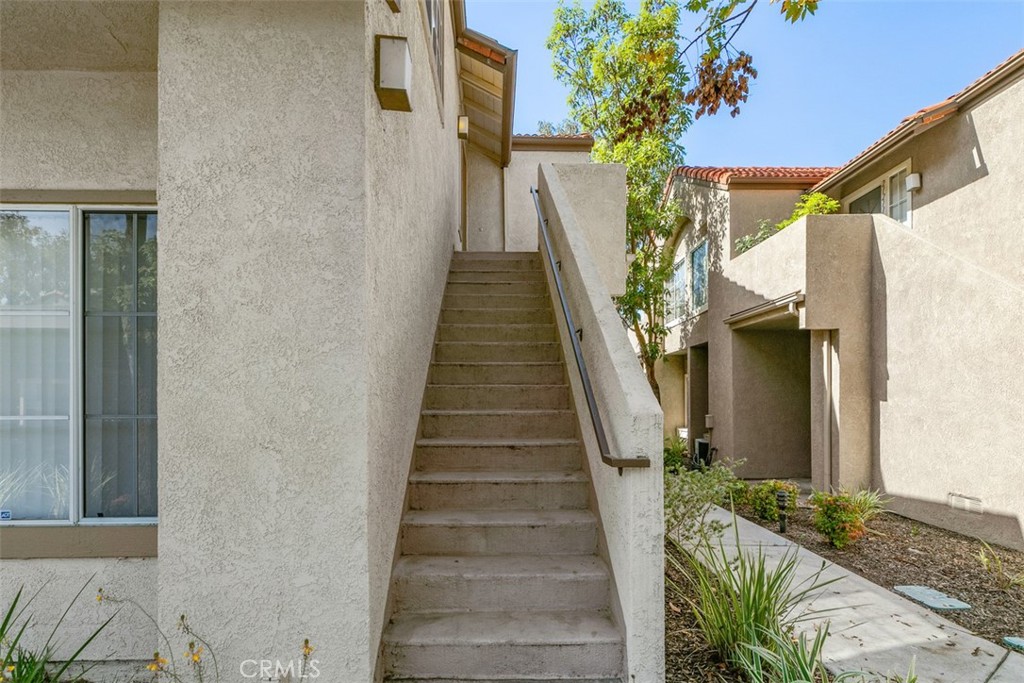 End unit with exterior stairs. - 21227 Camelia 18, Lake Forest CA 92630 - photo 6