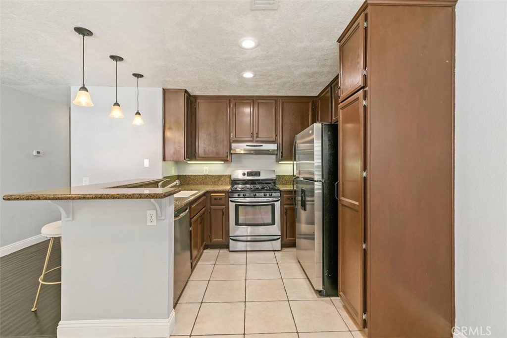 Remodeled kitchen. - 21227 Camelia 18, Lake Forest CA 92630 - photo 7