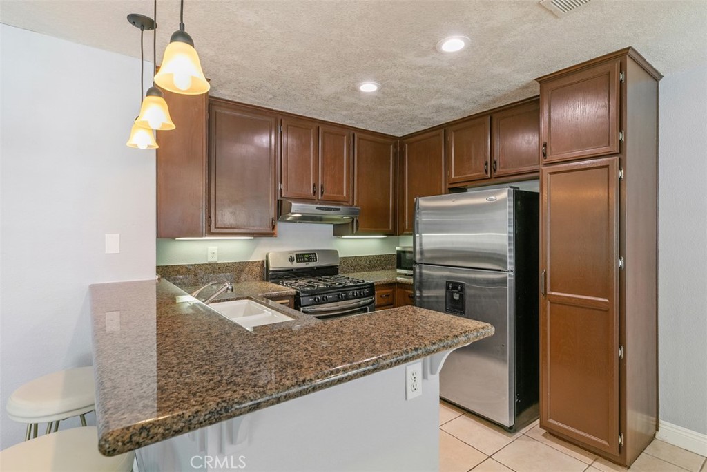 Remodeled kitchen. - 21227 Camelia 18, Lake Forest CA 92630 - photo 9