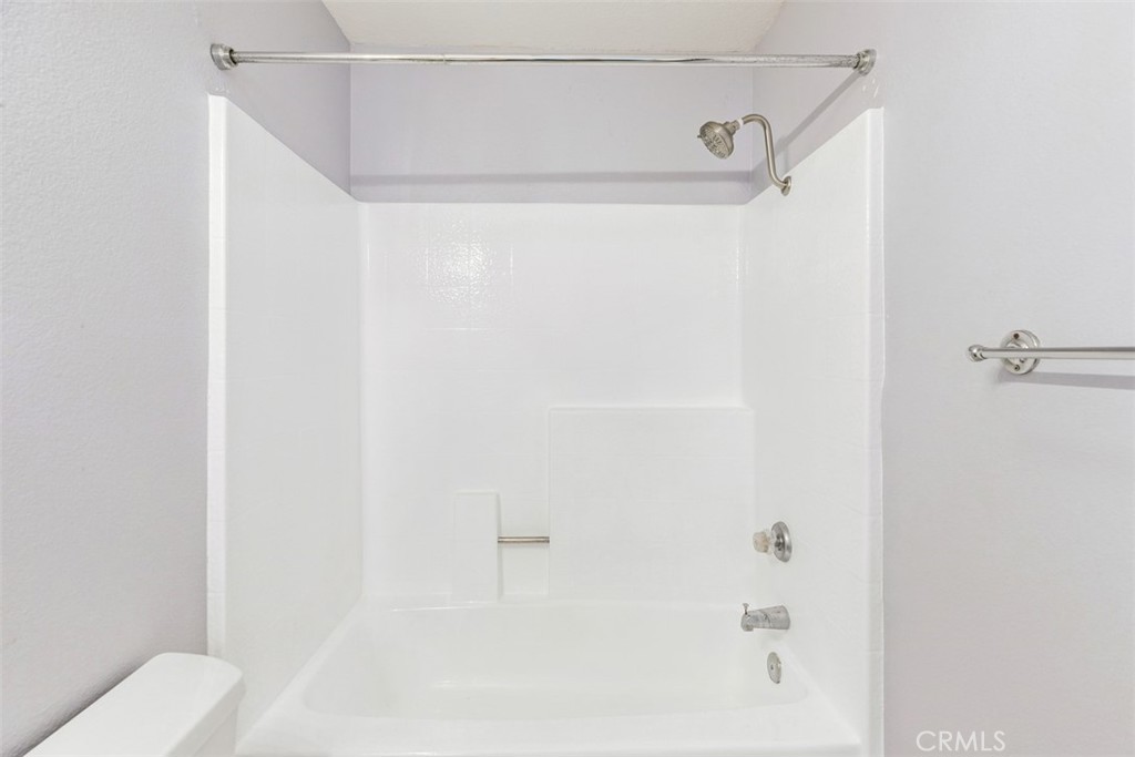 Primary bathtub & shower. - 21227 Camelia 18, Lake Forest CA 92630 - photo 14
