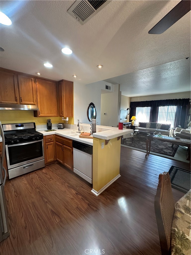 Kitchen and living room - 21245 Camelia 27, Lake Forest CA 92630 - photo 1