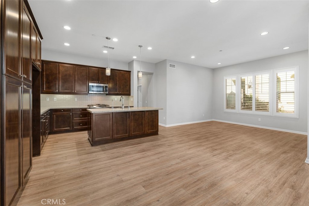 Open Concept Living with Kitchen open to living room! Plantation Shutters & Lots of Natural Light! - 219 Primrose Drive, Lake Forest CA 92610 - photo 4