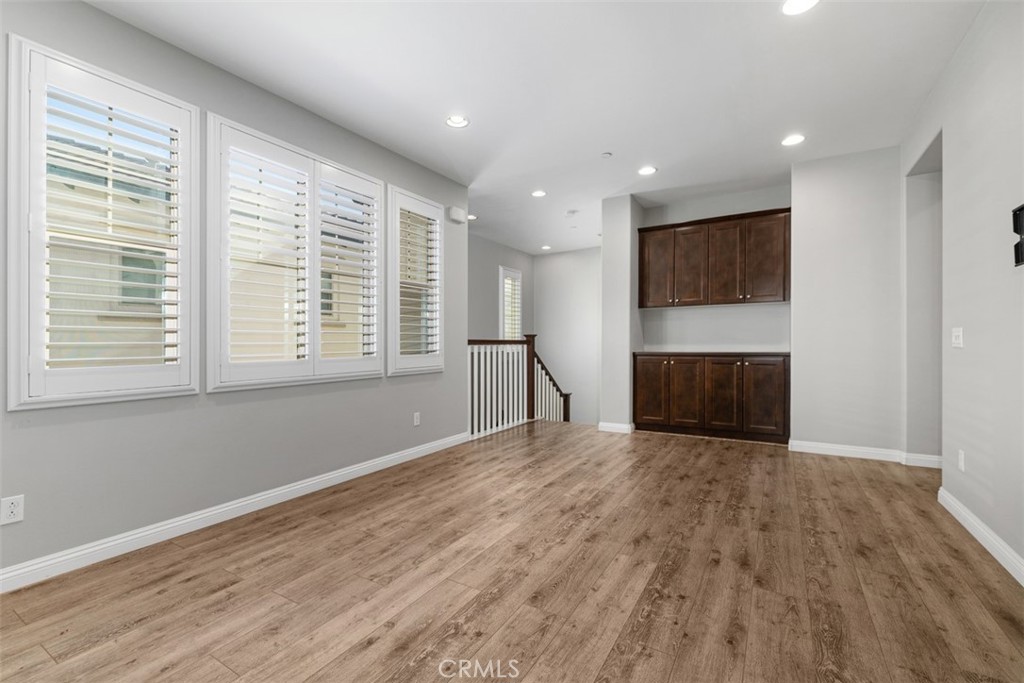 Upstairs Loft area! Upstairs Living Room with plantation shutters and convenient tv mount already installed! - 219 Primrose Drive, Lake Forest CA 92610 - photo 15