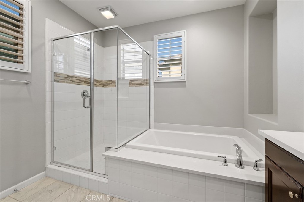 What a Relaxing Oasis! Primary Bathroom with large soaking tub and separate shower. - 219 Primrose Drive, Lake Forest CA 92610 - photo 20