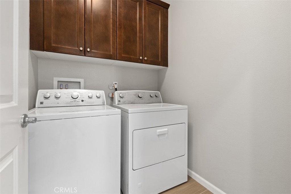 Upstairs Laundry Room - Washer and Dryer stay. - 219 Primrose Drive, Lake Forest CA 92610 - photo 26