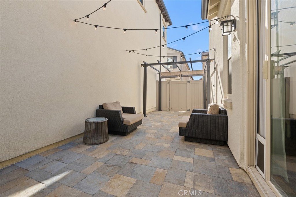 Patio has great lighting and pavers for ease of use and low​​‌​​​​‌​​‌‌​​‌‌​​‌‌​​‌​​​‌‌​‌​​​​‌‌​‌​​ maintenance. - 219 Primrose Drive, Lake Forest CA 92610 - photo 27