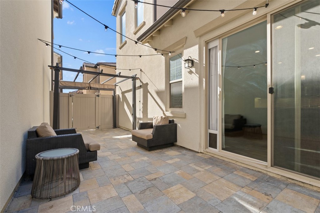 Patio has great lighting and pavers for ease of use and low maintenance. - 219 Primrose Drive, Lake Forest CA 92610 - photo 28