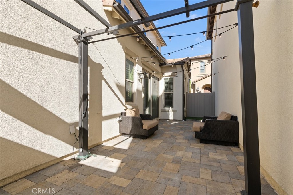 Patio has great lighting and pavers for ease of use and low maintenance. - 219 Primrose Drive, Lake Forest CA 92610 - photo 29