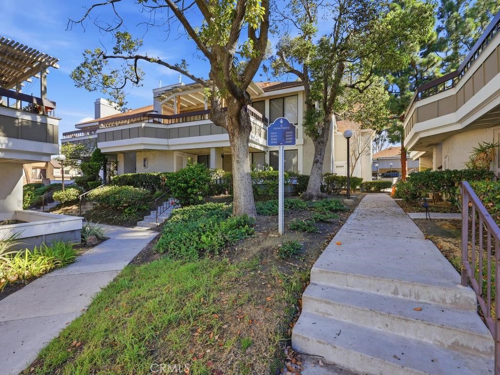 Walk up this pathway. Upstairs unit on the left corner lot - 22185 Cedar Pointe, Lake Forest CA 92630 - photo 12