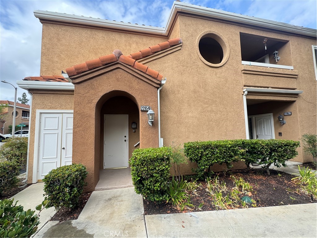 Entry to stairs, and garage access door. - 22854 Sailwind, Lake Forest CA 92630 - photo 4