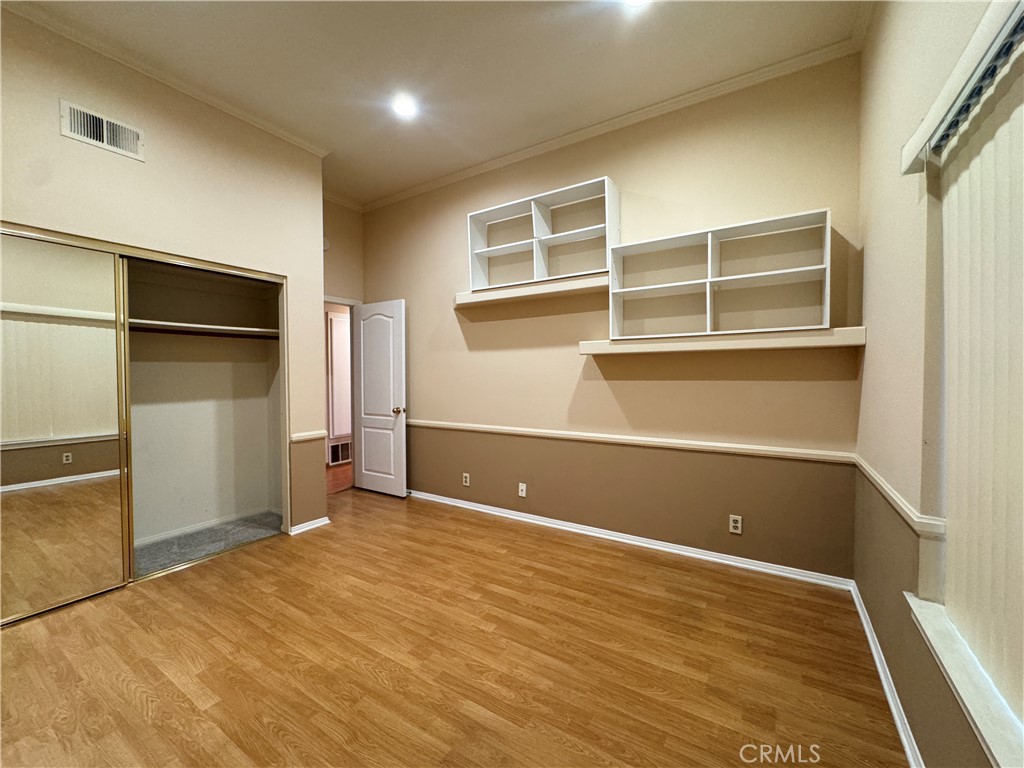Second Bedroom. Mirrored closet doors. - 22854 Sailwind, Lake Forest CA 92630 - photo 9
