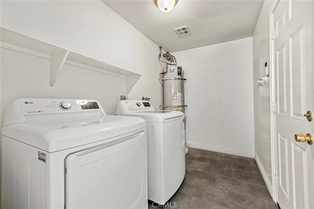 Indoor laundry with room for storage - 22946 Moonstone, Lake Forest CA 92630 - photo 20