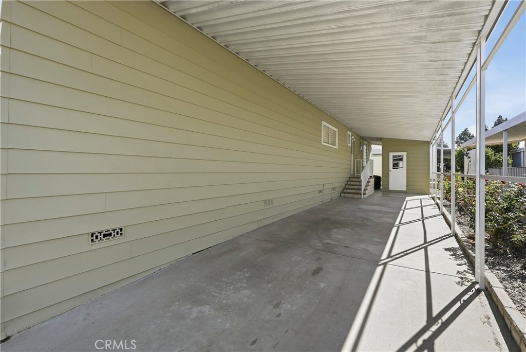Covered carport with storage shed - 24001 Muirlands Boulevard 440, Lake Forest CA 92630 - photo 47