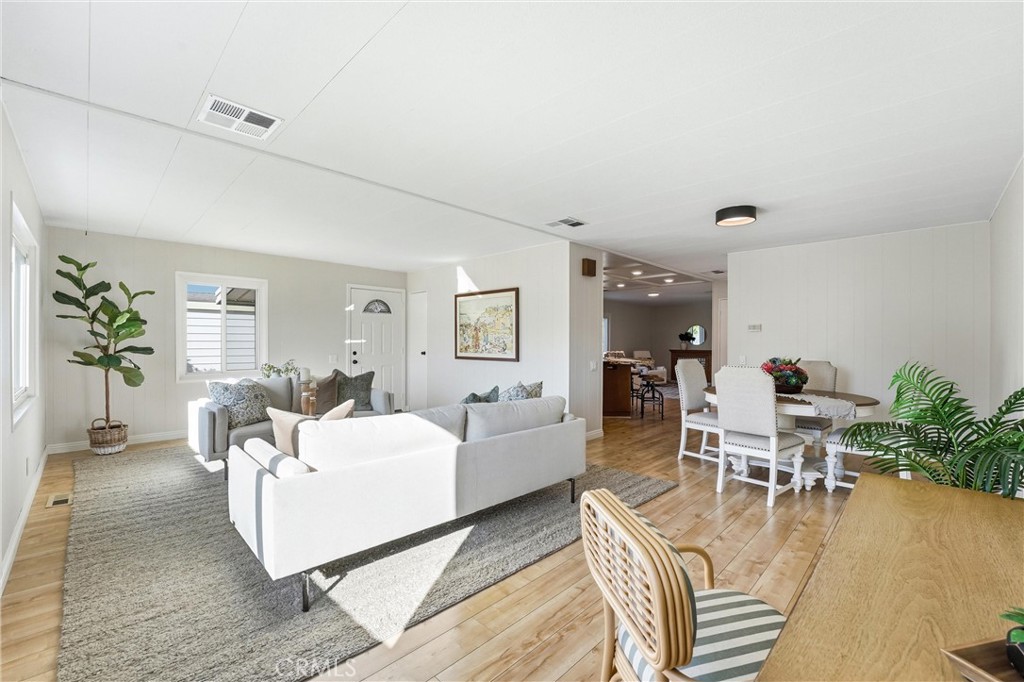 open concept to living/dining/kitchen - 24001 Muirlands Boulevard 64, Lake Forest CA 92630 - photo 8