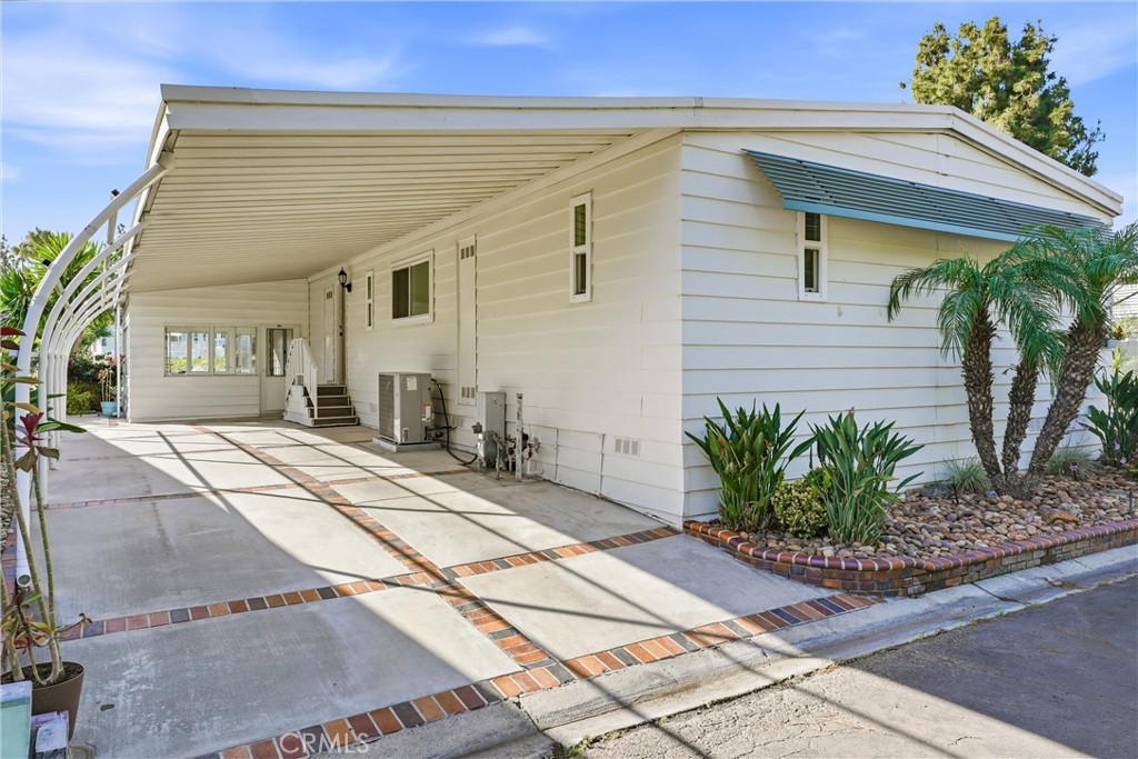 carport & bonus sunroom - 24001 Muirlands Boulevard 64, Lake Forest CA 92630 - photo 20
