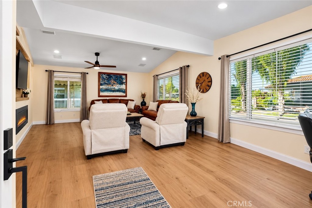 Inviting entry to the spacious living room and fireplace area. - 24701 Raymond Way 135, Lake Forest CA 92630 - photo 6