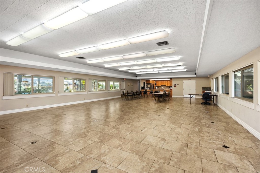 Spacious clubhouse with open gathering areas, kitchen and prlenty of room for community activities. - 24701 Raymond Way 135, Lake Forest CA 92630 - photo 36