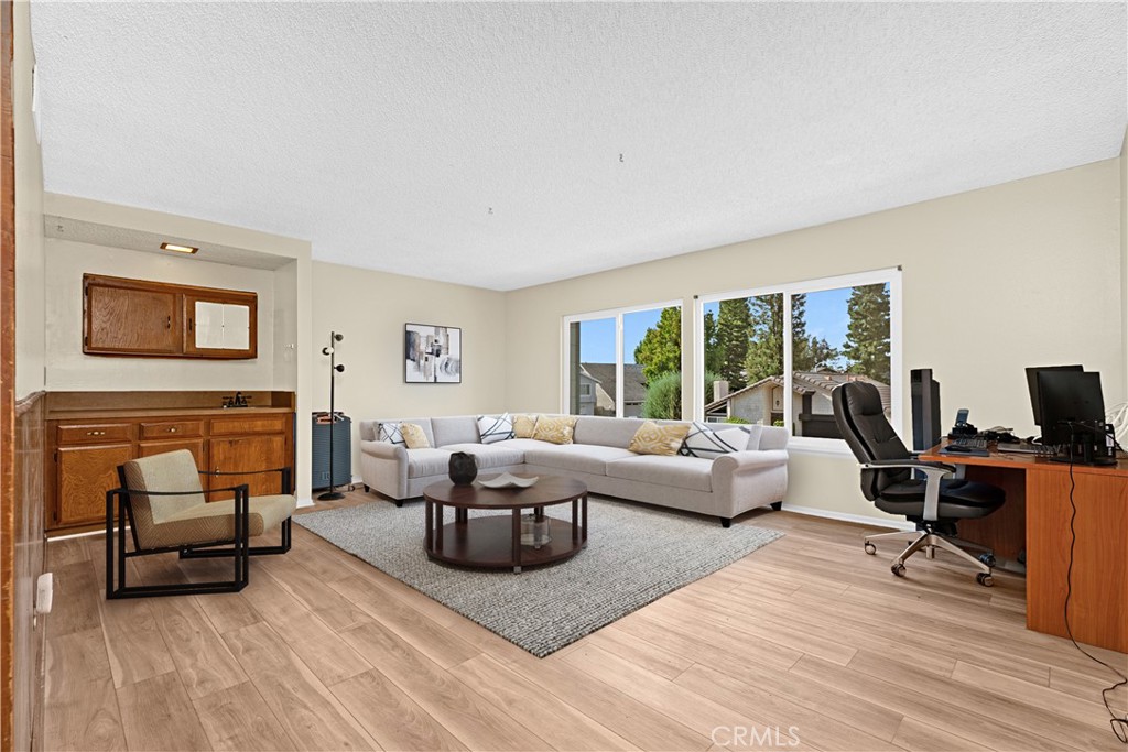 Enjoy this huge bonus room with fresh paint, luxury laminate flooring & double pane windows. *Photo is virtually staged. - 24712 Via Del Rio, Lake Forest CA 92630 - photo 15