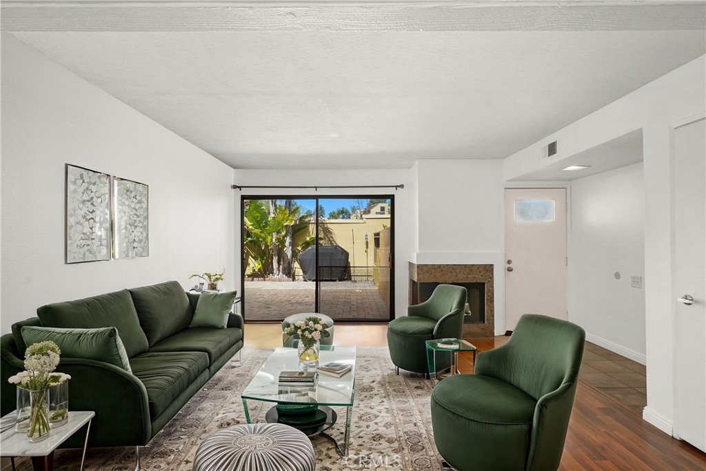 Good size living room Virtually staged - 25712 Le Parc 21, Lake Forest CA 92630 - photo 1