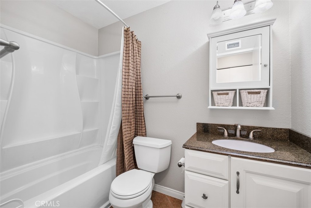 This is the remodeled primary bathroom - 25885 Trabuco 16, Lake Forest CA 92630 - photo 2