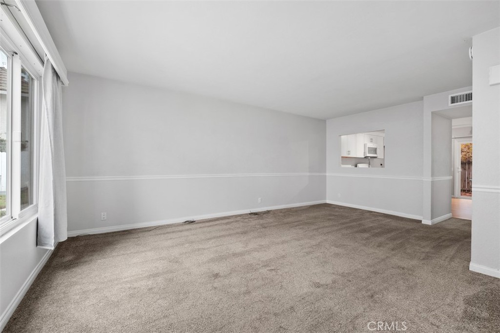 This is a view of the living room space - 25885 Trabuco 16, Lake Forest CA 92630 - photo 3