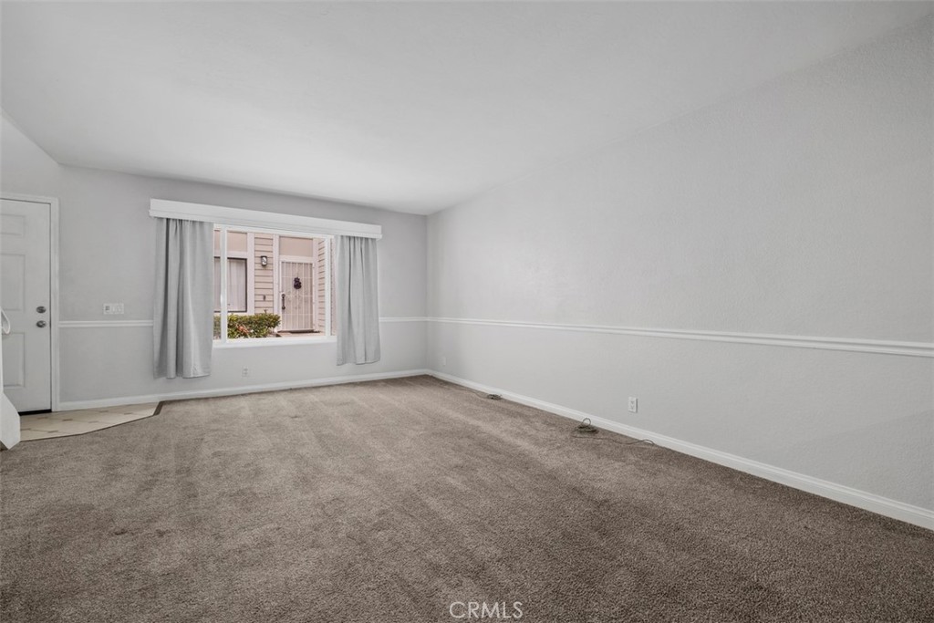 Here is another look at the large living room space - 25885 Trabuco 16, Lake Forest CA 92630 - photo 4