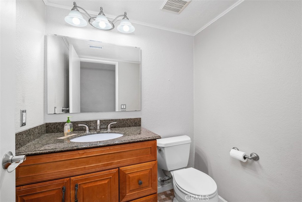 This is a view of the remodeled downstairs bathroom - 25885 Trabuco 16, Lake Forest CA 92630 - photo 7